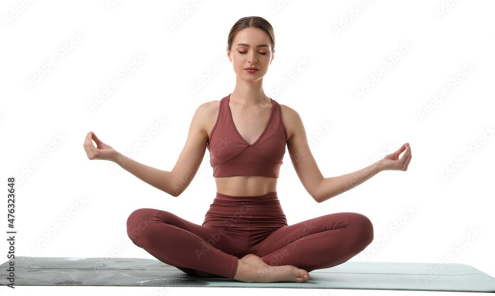 Beautiful young woman meditating on white background