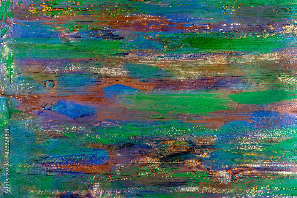 Broad brushstrokes form a background of a multi colored board . Broad brushstrokes form a background of a multi colored board .