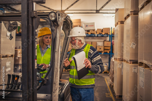 Group of workers working in a warehouse.