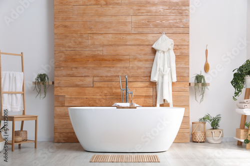 White tub and beautiful plants in bathroom, Interior design Fototapet