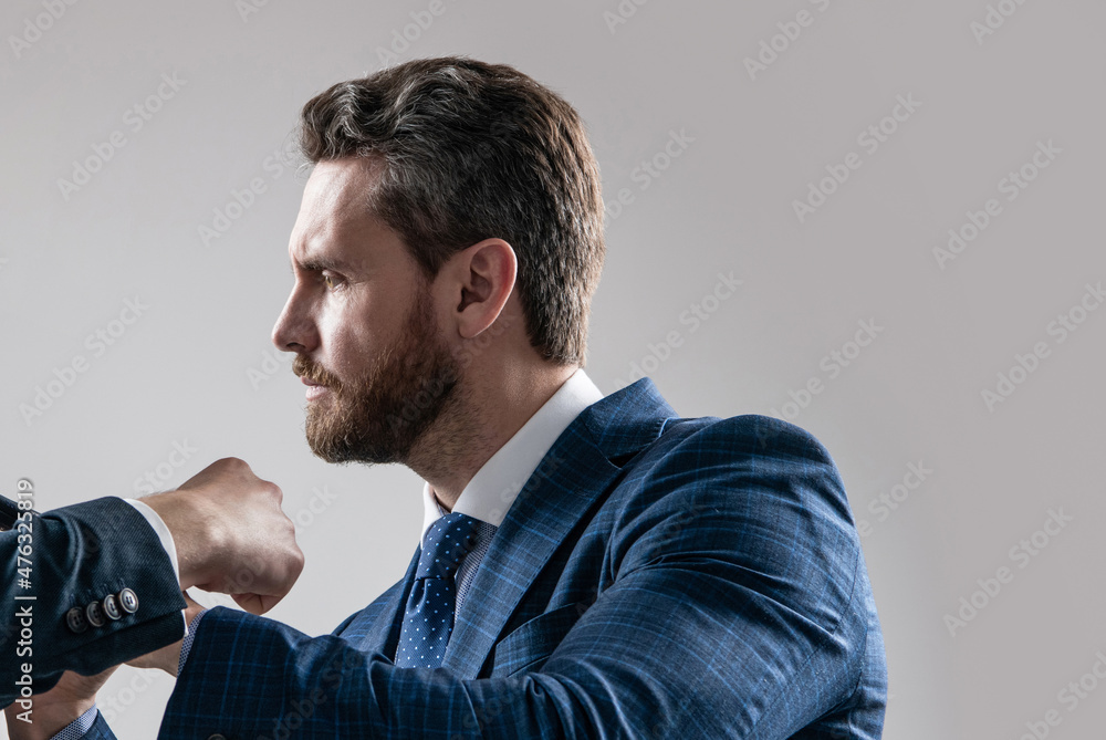 Professional employee man got in physical fight grey background, fighting Professional employee man got in physical fight grey background, fighting