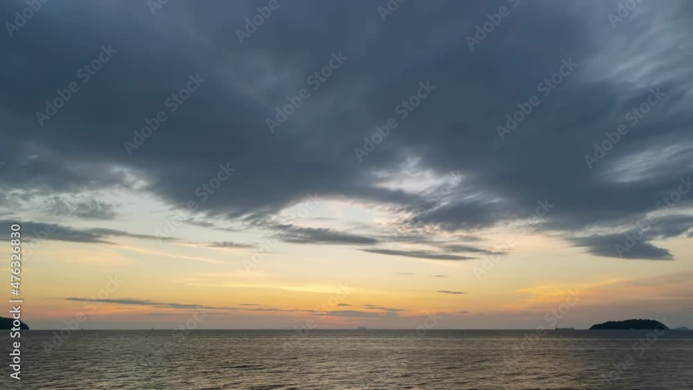 Time Lapse clouds in sunrise time Beautiful light of nature Amazing colors of sun Majestic clouds flowing in sunrise sky Dark clouds Time Lapse sky in phuket island Thailand on December 18-2021 Time Lapse clouds in sunrise time Beautiful light of nature Amazing colors of sun Majestic clouds flowing in sunrise sky Dark clouds Time Lapse sky in phuket island Thailand on December 18-2021