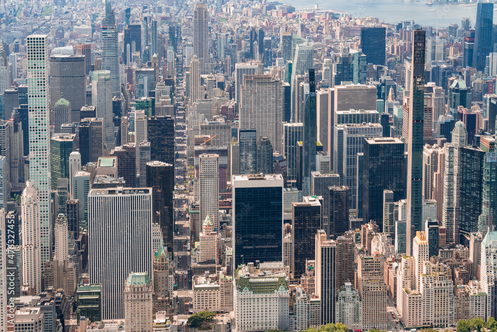 Aerial panoramic city view of Midtown Manhattan neighborhoods towards lower Manhattan, Central Park on bottom, New York City. Bird's eye view from helicopter of metropolis cityscape