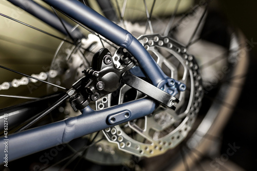 Obraz na plátně Rear hydraulic disc brake rotor on new blue clip-on bicycle wheel, close-up