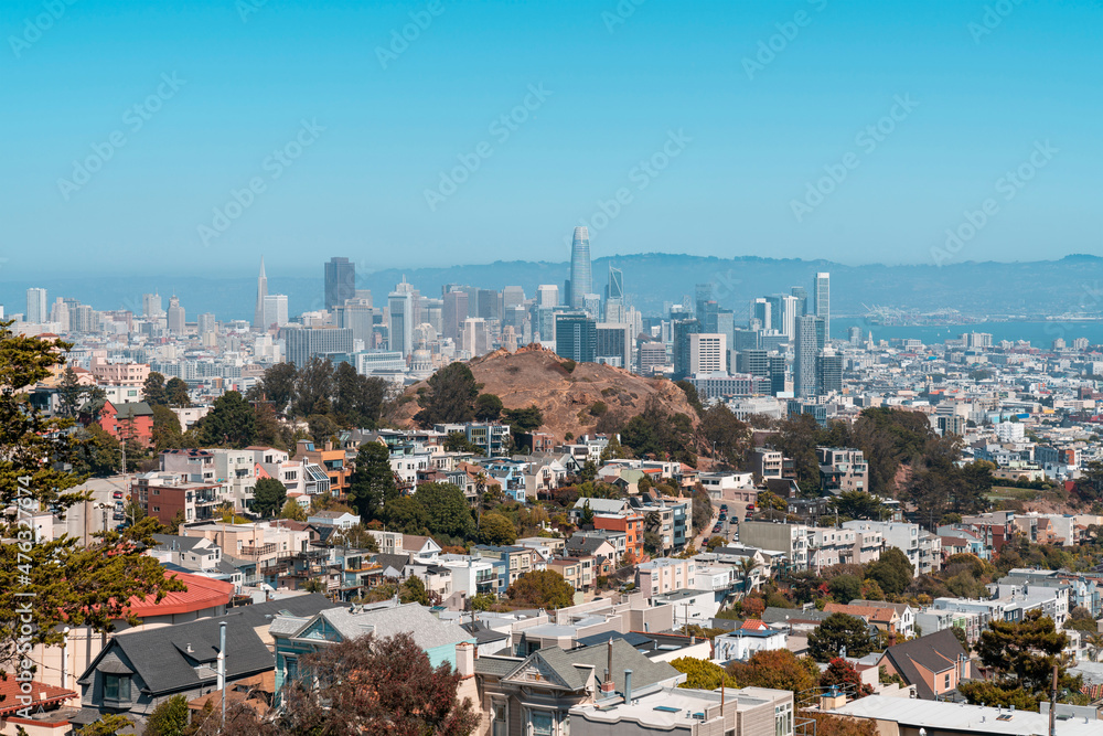 Panoramic view of San Francisco skyline at daytime from hill side area. Financial District and residential neighborhoods, California, United States.