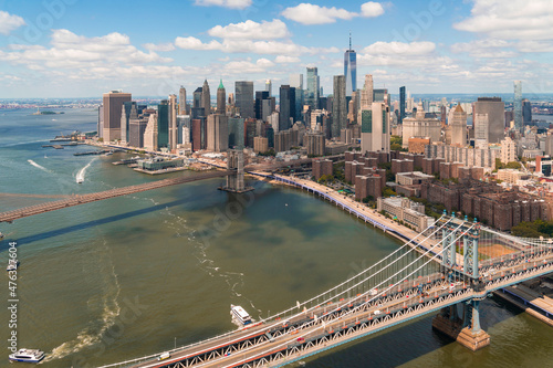Aerial panoramic city view ofLower Manhattan area. Brooklyn and Manhattan bridges over East River, New York City, USA. Bird's eye view from helicopter of metropolis cityscape. A business neighborhood. © VideoFlow