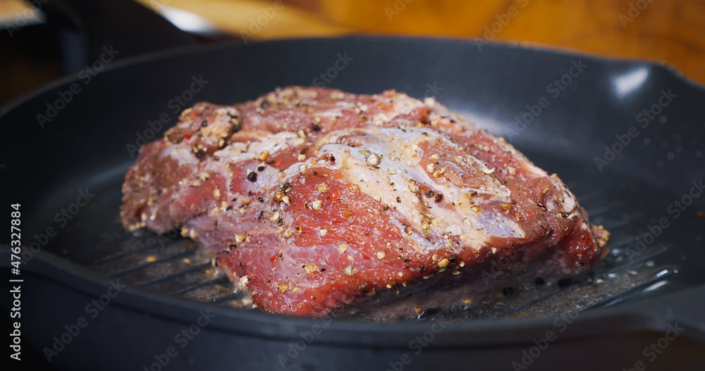 Delicious Juicy Meat Steak Cooking on Grill. Hot Pan. Delicious Juicy Meat Steak Cooking on Grill. Hot Pan.