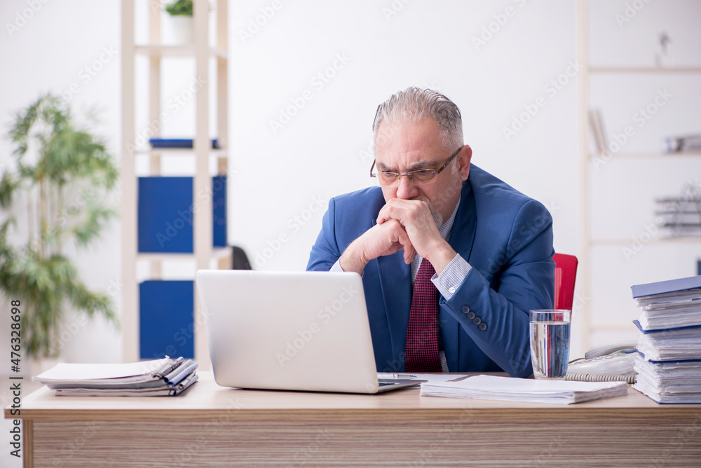 Old male employee and too much work in the office