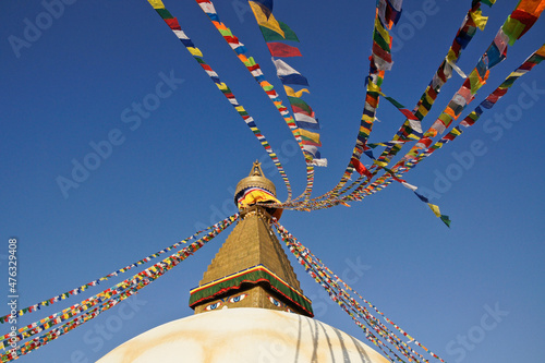Boudhanath Tibetan Buddhist stupa with colorful prayer flags flying, Kathmandu, Nepal
