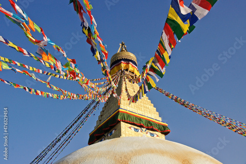 Boudhanath Tibetan Buddhist stupa with colorful prayer flags flying, Kathmandu, Nepal