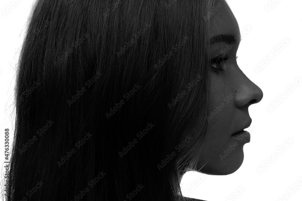 A black and white profile portrait of an attractive woman. A black and white profile portrait of an attractive woman.