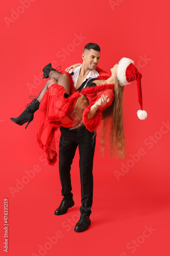 Sexy young couple on color ...