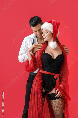 Sexy young couple on color ...