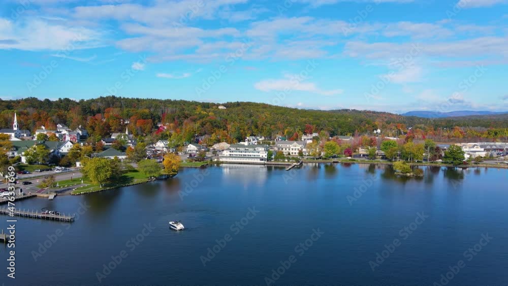Bay point at Mill Falls with fall foliage aerial view with Meredith Bay in Lake Winnipesaukee in town of Meredith, New Hampshire NH, USA. Bay point at Mill Falls with fall foliage aerial view with Meredith Bay in Lake Winnipesaukee in town of Meredith, New Hampshire NH, USA.