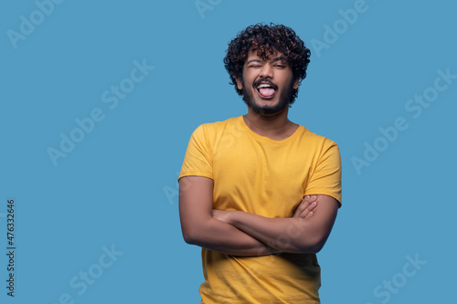 Wallpaper Mural Funny curly-haired bearded Indian guy making faces Torontodigital.ca