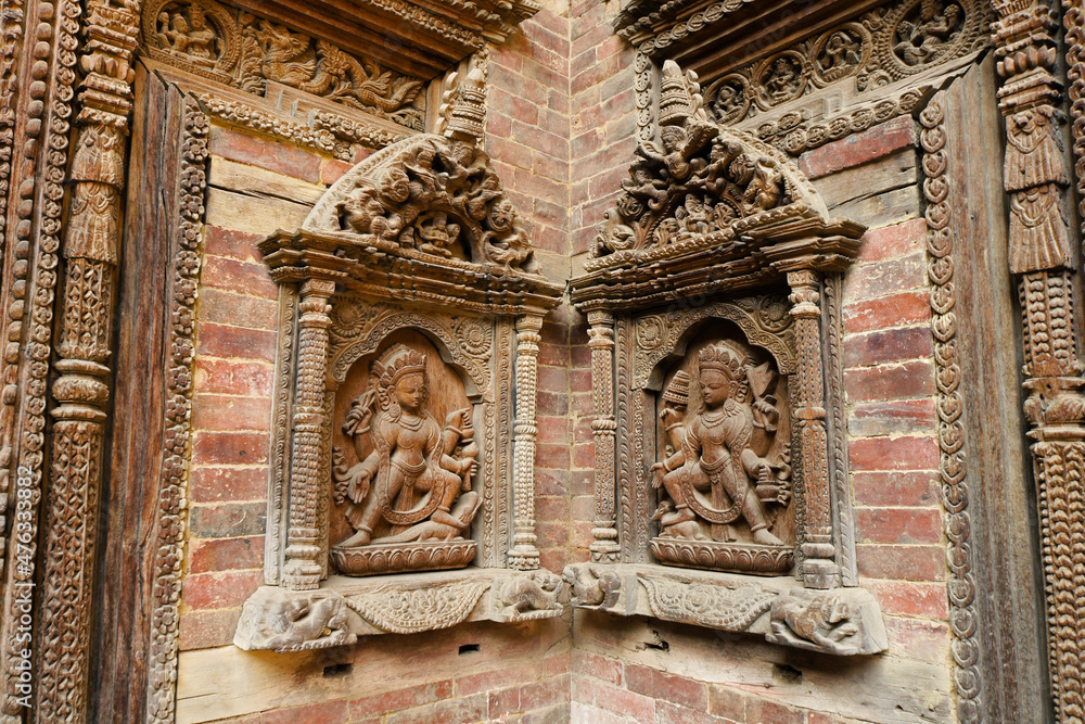 Carved wood figures in niches at Royal Palace, Sundari Chowk wing, Durbar Square, Patan, Kathmandu Valley, Nepal