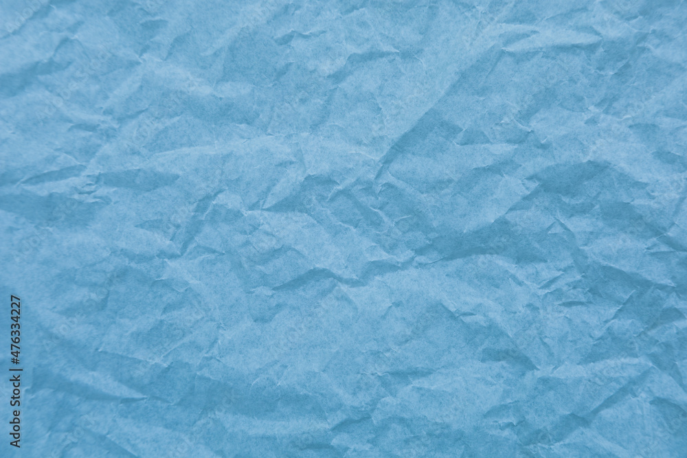 Obraz premium Blue paper with wrinkles texture