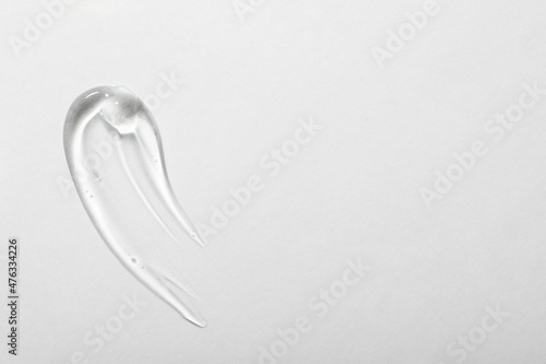 Fotografie Sample of cosmetic gel on white background, top view