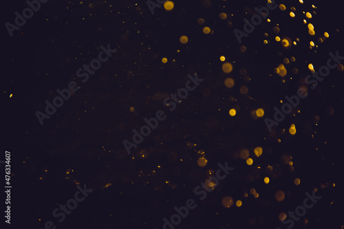 Abstract gold bokeh blur defocus with black background