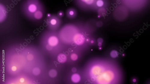 blurred pink particles on black background. blurred pink background