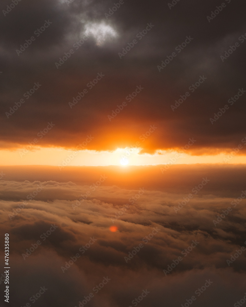 sunburst between clouds during a beautiful sunset