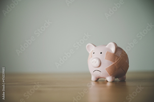 Fotografie Piggy bank on wood table