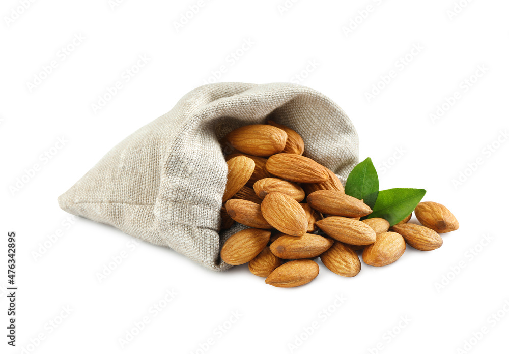 Sack with organic almond nuts and green leaves on white background. Healthy snack Sack with organic almond nuts and green leaves on white background. Healthy snack