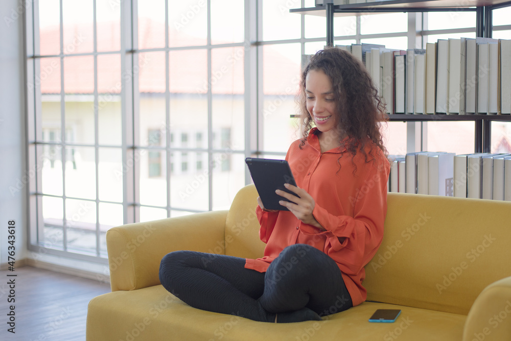 Woman using smartphone to communicate with customers. Latino woman chatting with a friend using a smartphone. Woman using smartphone to communicate with customers. Latino woman chatting with a friend using a smartphone.