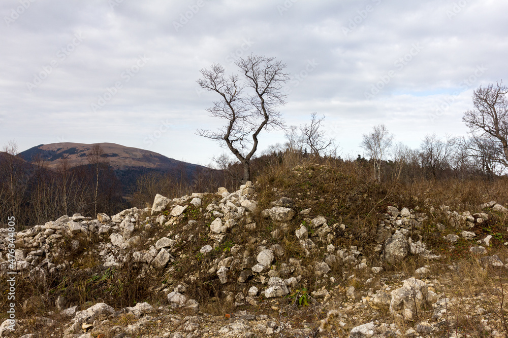 A stone plateau in a mountainous area, autumn, cloudy day.