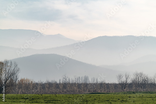 Silhouettes of mountains in the sunset haze