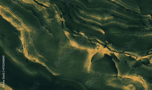 green marble with golden veins. green golden natural texture of marble. abstract green, white, gold and yellow marbel. hi gloss texture of marble stone for digital wall tiles design. 