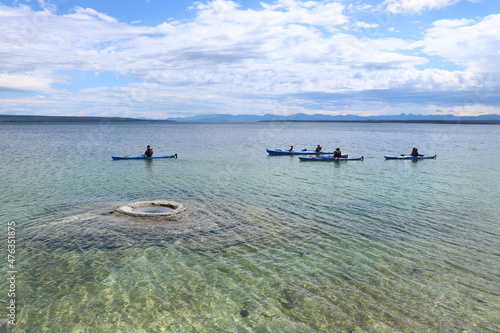 Kayaking amongst the geysers and volcanic steam vents at Yellowstone Lake in Yellowstone National Park, Wyoming