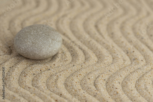Canvas Print Zen sand garden meditation stone background with copy space