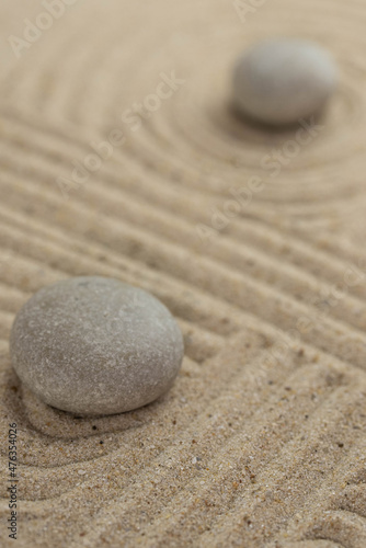 Canvas Print Zen sand garden meditation stone background with copy space