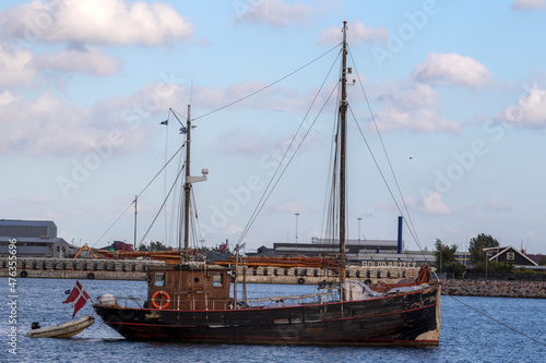 small ship in the blue water sea 