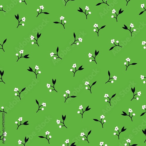 Vintage floral background. Seamless vector pattern for design and fashion prints. Elegant floral pattern with small white flowers on a green background.