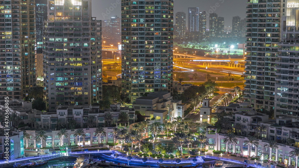 Picturesque fountain on Dubai Marina promenade aerial night timelapse Picturesque fountain on Dubai Marina promenade aerial night timelapse
