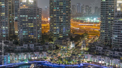 Picturesque fountain on Dubai Marina promenade aerial night timelapse