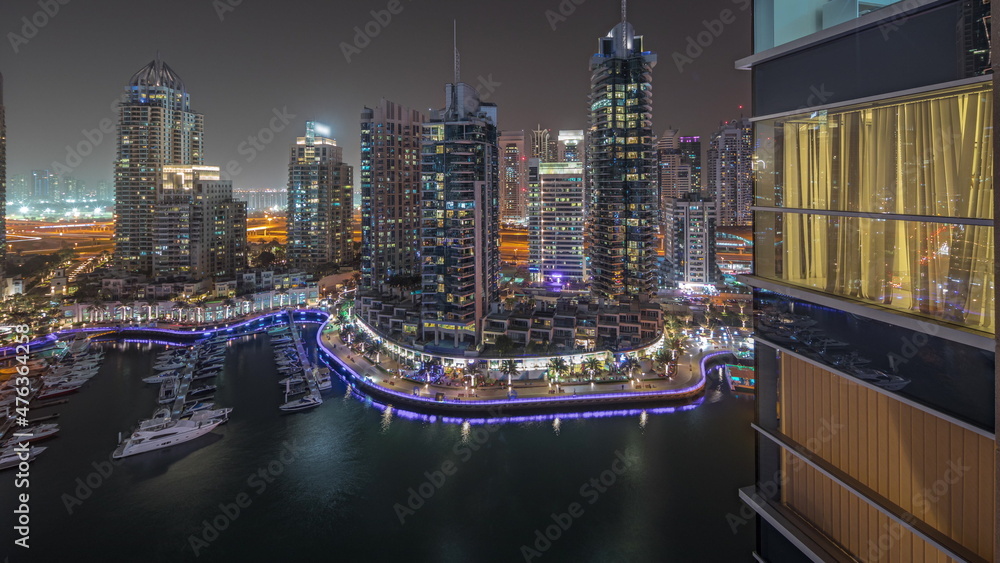 Panorama showing luxury yacht bay in the city aerial night timelapse in Dubai marina Panorama showing luxury yacht bay in the city aerial night timelapse in Dubai marina