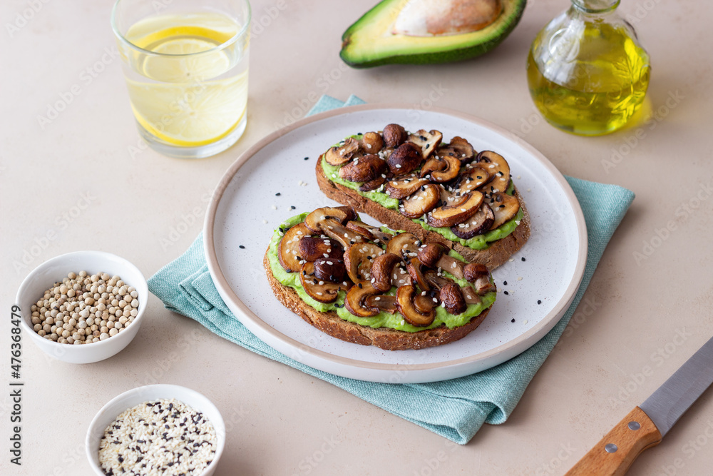 Bruschetta with mushrooms and avocados. Healthy eating. Vegetarian food. Keto diet.