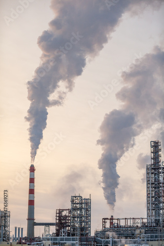 Petrochemical industrial factory of heavy industry, power refinery production with smoke pollution.Thick smoke is coming from the factory's chimney. smoke smog emissions bad ecology aerial photography