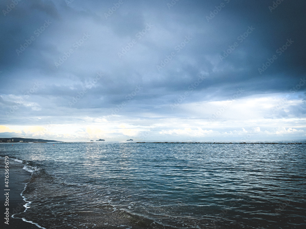 Fototapeta premium Dark clouds at the sea, evening time, dark seascape