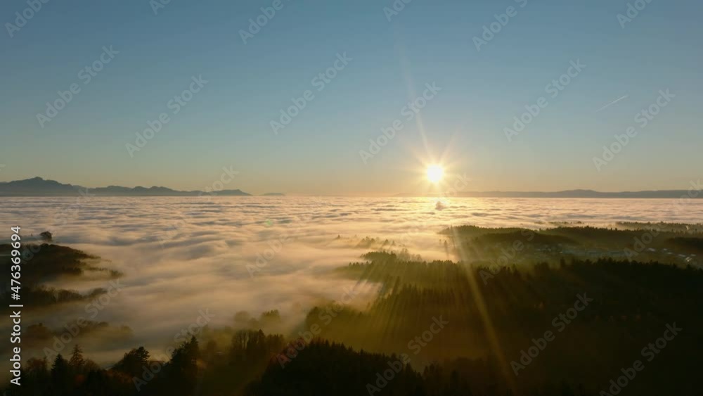 The Woodlands Near Savigny Village In Winter Fog Covering The Entire Geneva Lake Region, Vaud, Switzerland During Sunset. - Aerial The Woodlands Near Savigny Village In Winter Fog Covering The Entire Geneva Lake Region, Vaud, Switzerland During Sunset. - Aerial