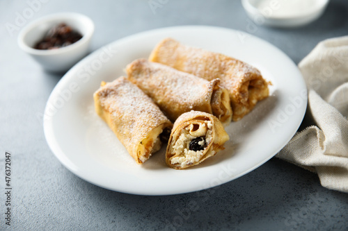 Homemade crepes with ricotta and raisins