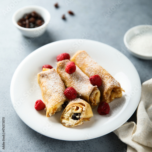 Homemade crepes with ricotta and raisins