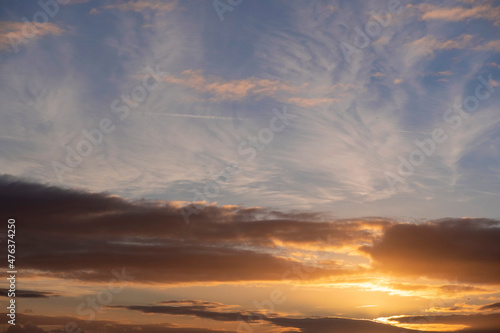 Amazing sunset sky with rich saturated natural warm and cool colors. Abstract background.