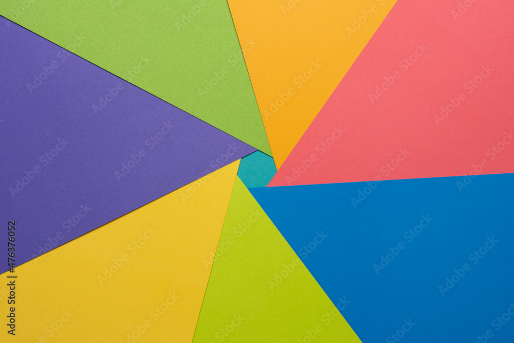 
Different multicolored backgrounds. Layered color papers, color paper materials for the banner. Geometric pattern in green, light green, purple, yellow, blue, pink, light blue. Top view. Flat lay sty