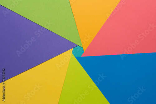 Different multicolored backgrounds. Layered color papers, color paper materials for the banner. Geometric pattern in green, light green, purple, yellow, blue, pink, light blue. Top view. Flat lay sty