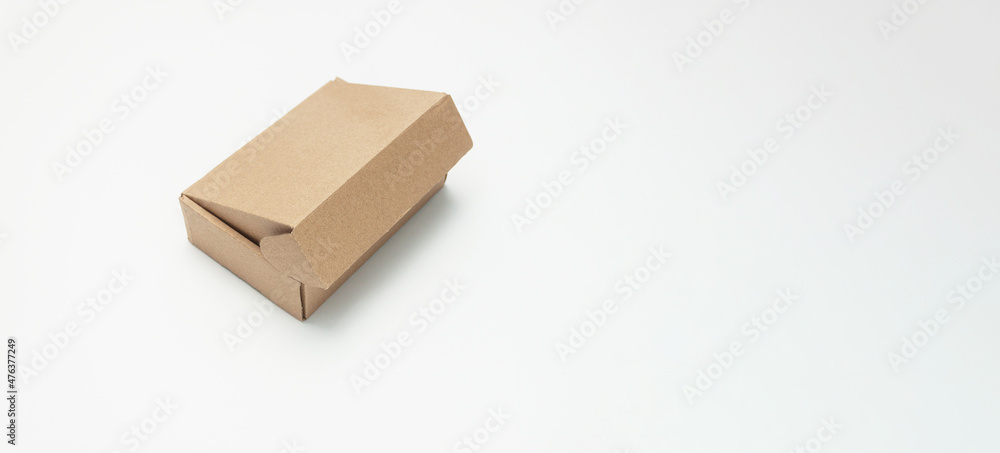 Small cardboard box for storing things on a white background.