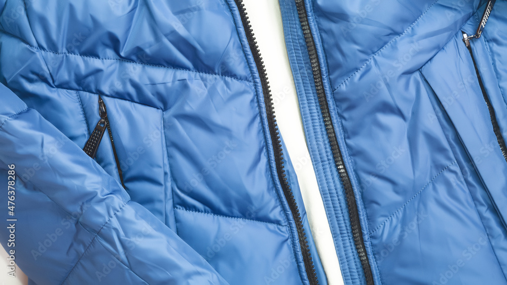blue puffer jacket material as background close up blue puffer jacket material as background close up
